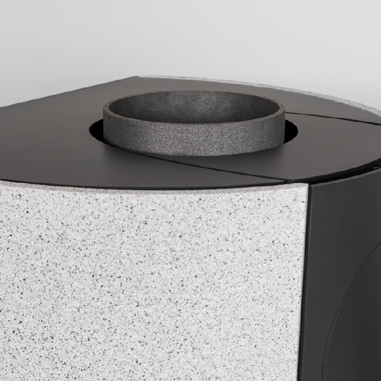 The steel cover plate connects the stone elements to the glass facade.